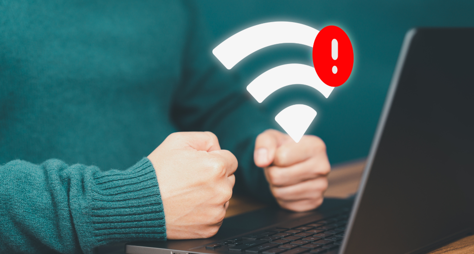 A person experiencing frustration due to a lost or unreliable Wi-Fi internet connection.